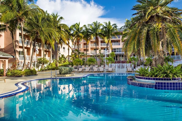 Outdoor pool, open 7:00 AM to 11:00 PM, free pool cabanas, pool loungers