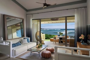 Club Bungalow, 1 King Bed, Patio, Oceanfront | Living area | 65-inch flat-screen TV with cable channels, TV, pay movies
