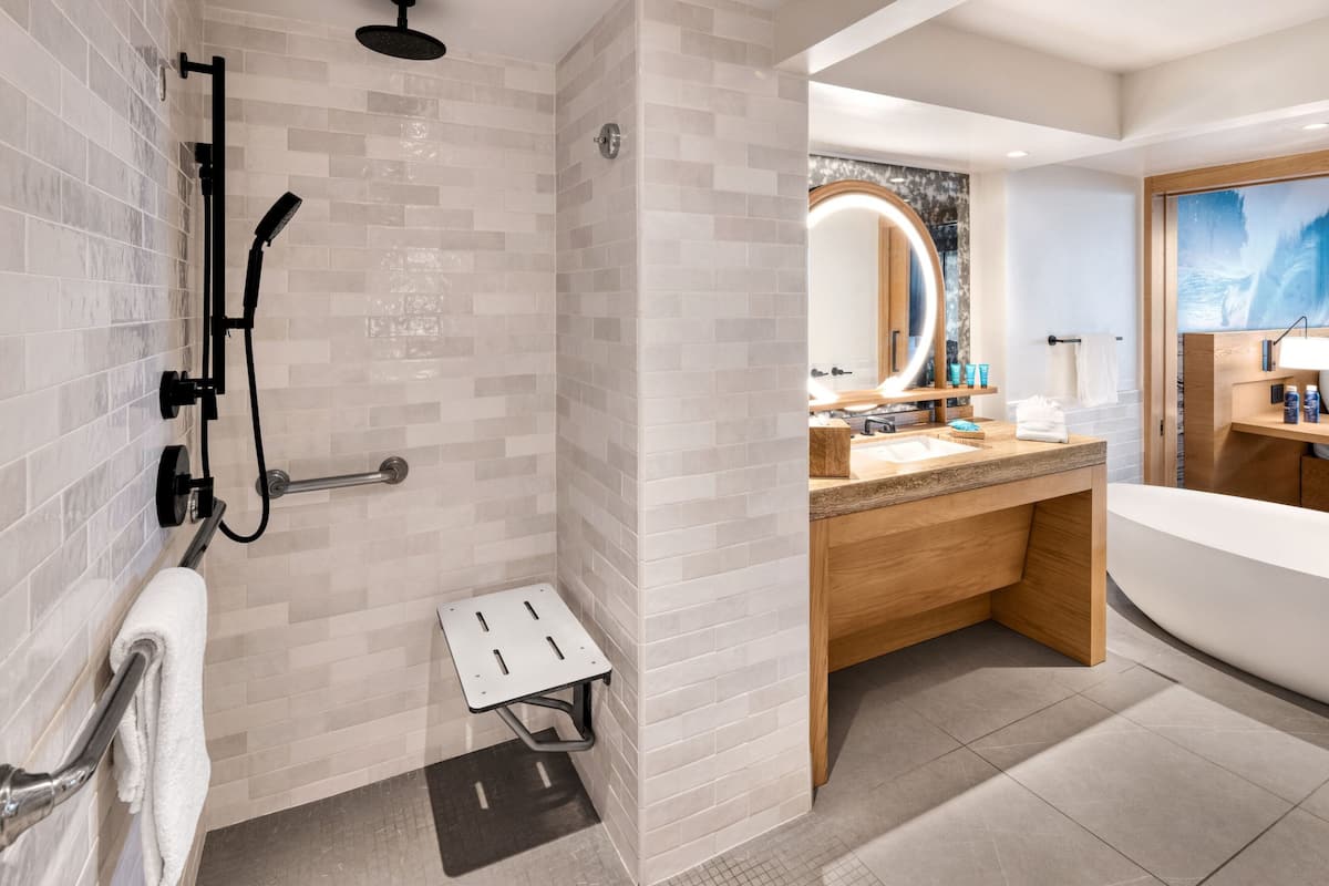 Separate bathtub and shower, deep-soaking bathtub, hair dryer, towels