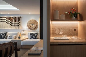 A modern living room with a sofa, coffee table, and decorative wall art.