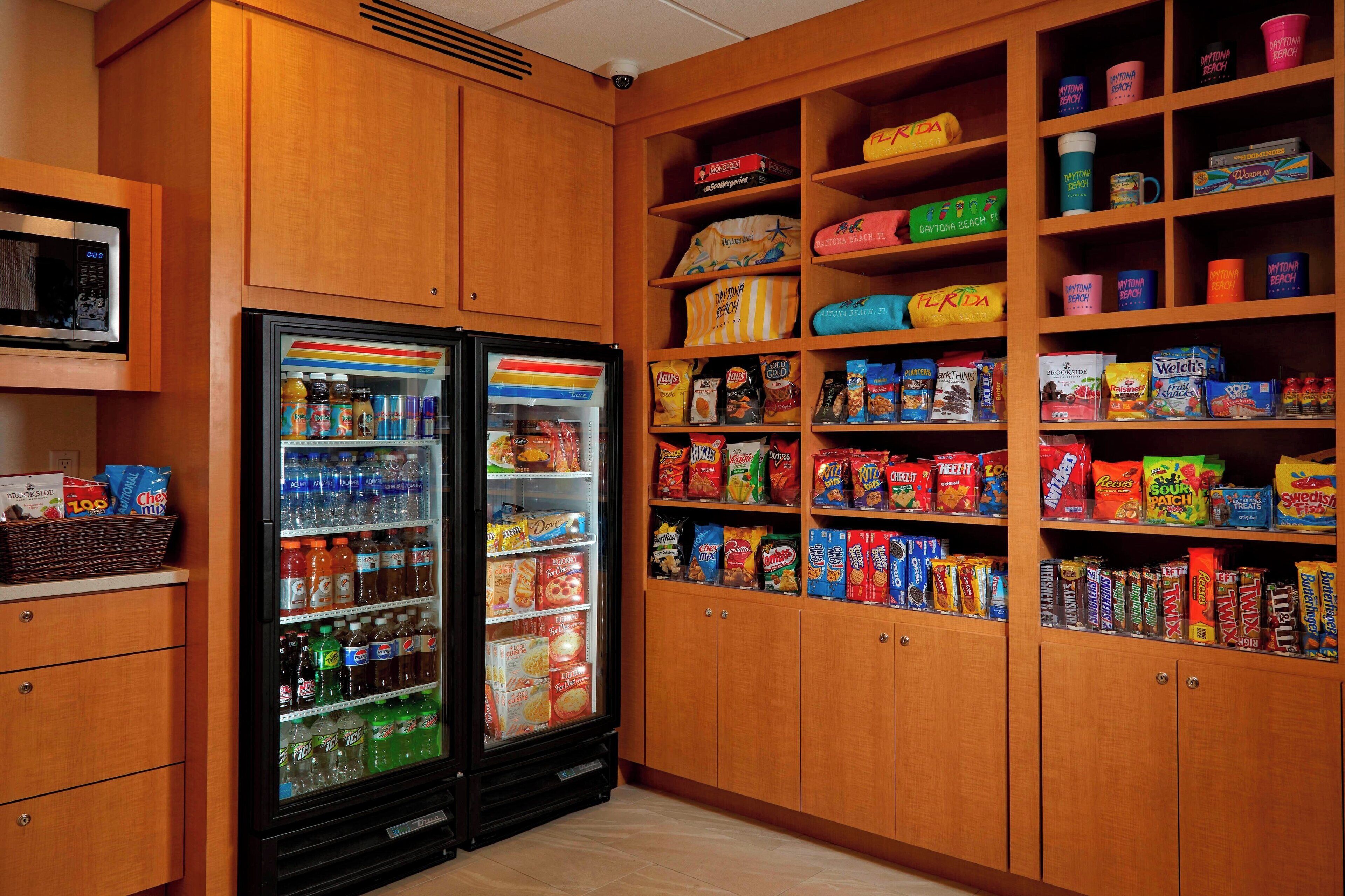 A vending area with snack and drink options, including microwaves and a refrigerator.