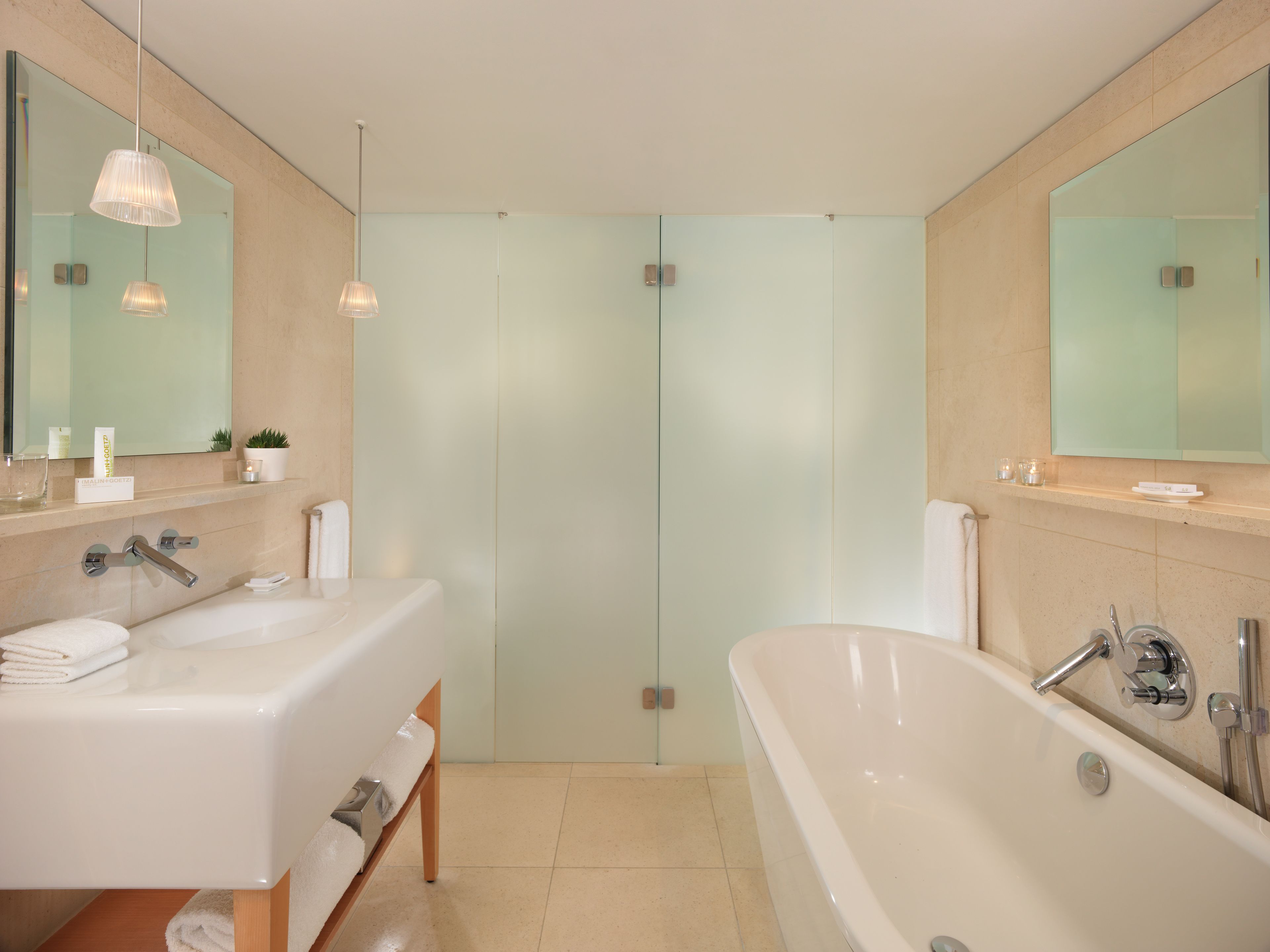 designer toiletries, hair dryer, bathrobes, slippers