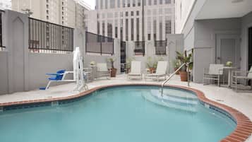 Outdoor pool, open 9:00 AM to 10:00 PM, pool loungers