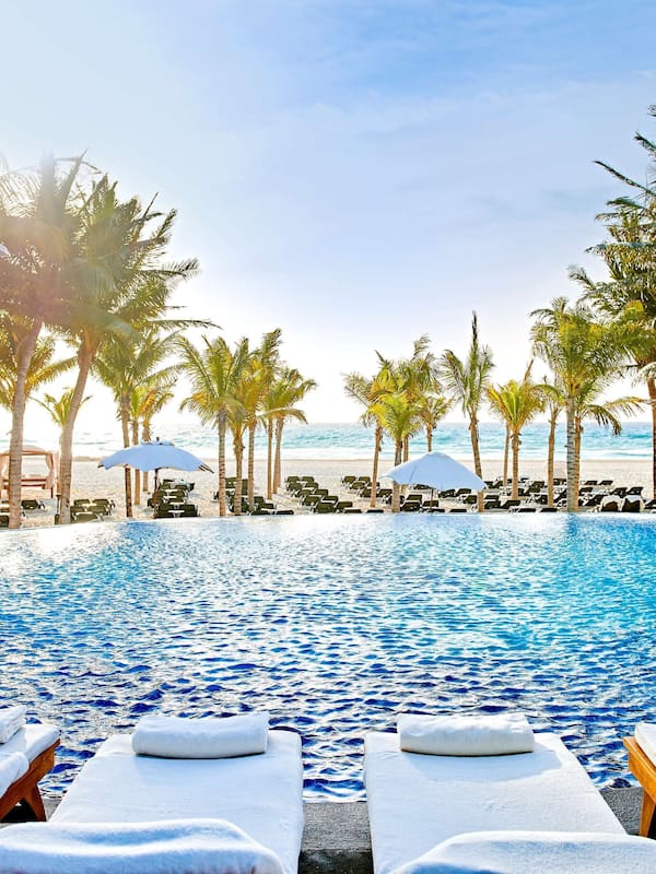 Outdoor pool, sun loungers, lifeguards on site