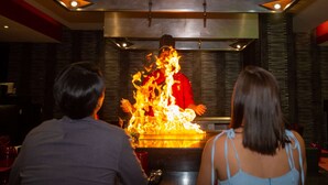 A chef performing a fire act at a restaurant. - Occidental Nuevo Vallarta - All Inclusive (Nuevo Nayarit)