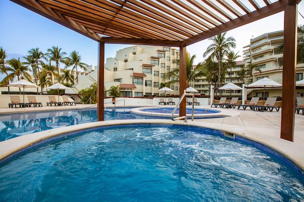 3 outdoor pools, open 8 AM to 8 PM, pool loungers
