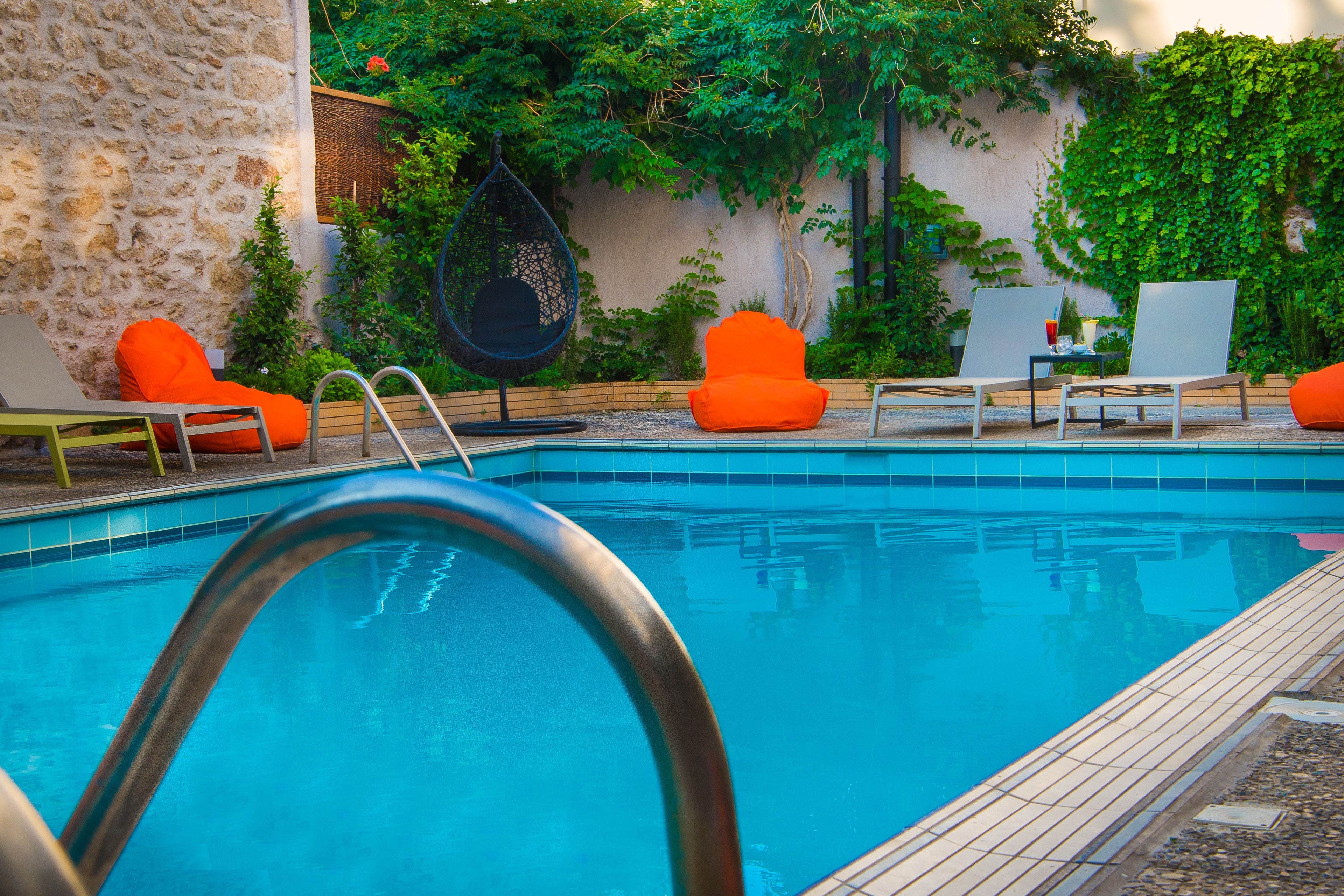 outdoor pool, pool umbrellas, pool loungers