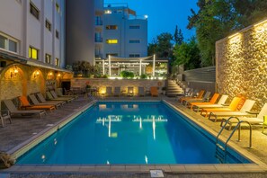Outdoor pool, pool umbrellas, sun loungers