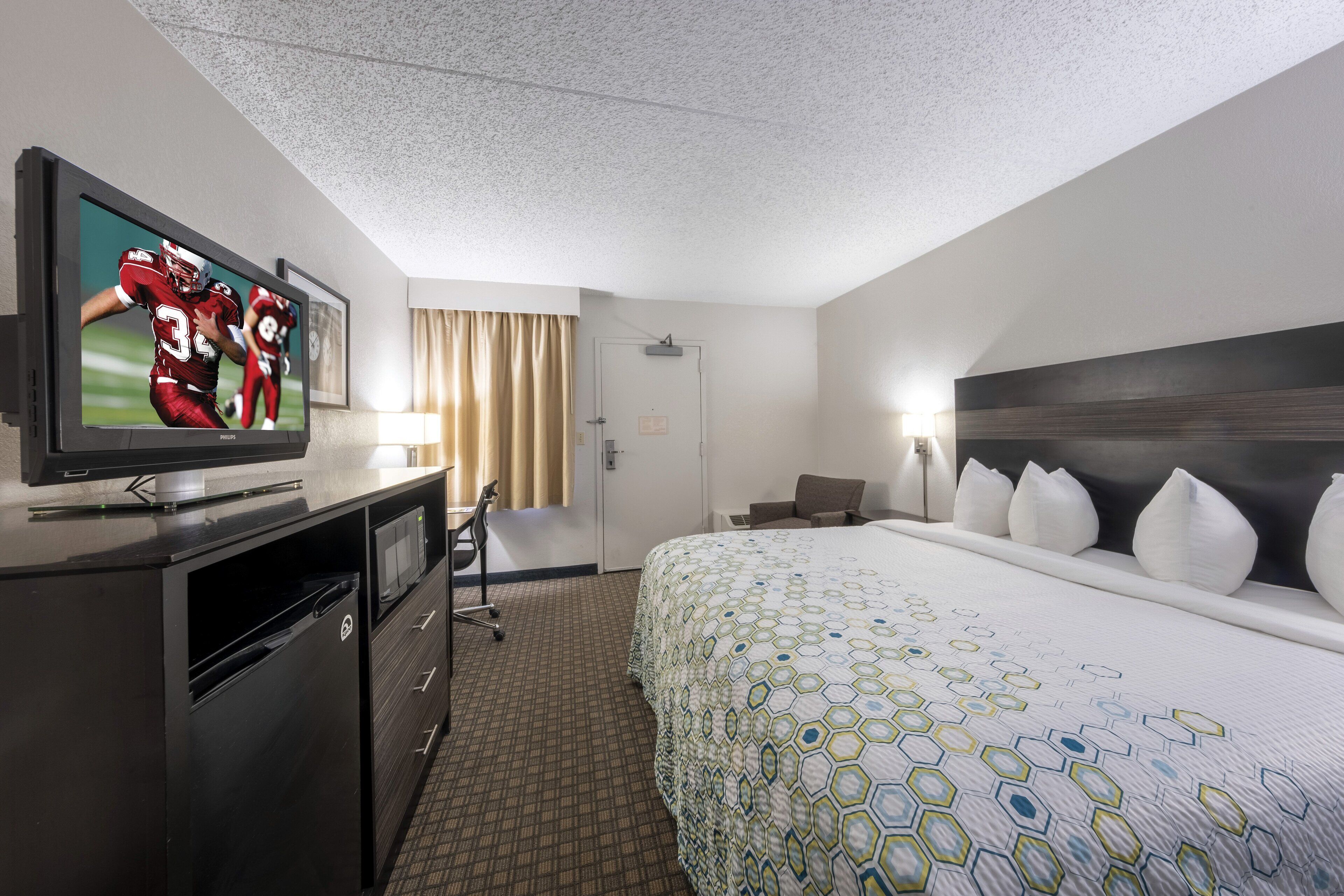 desk, laptop workspace, blackout curtains, iron/ironing board