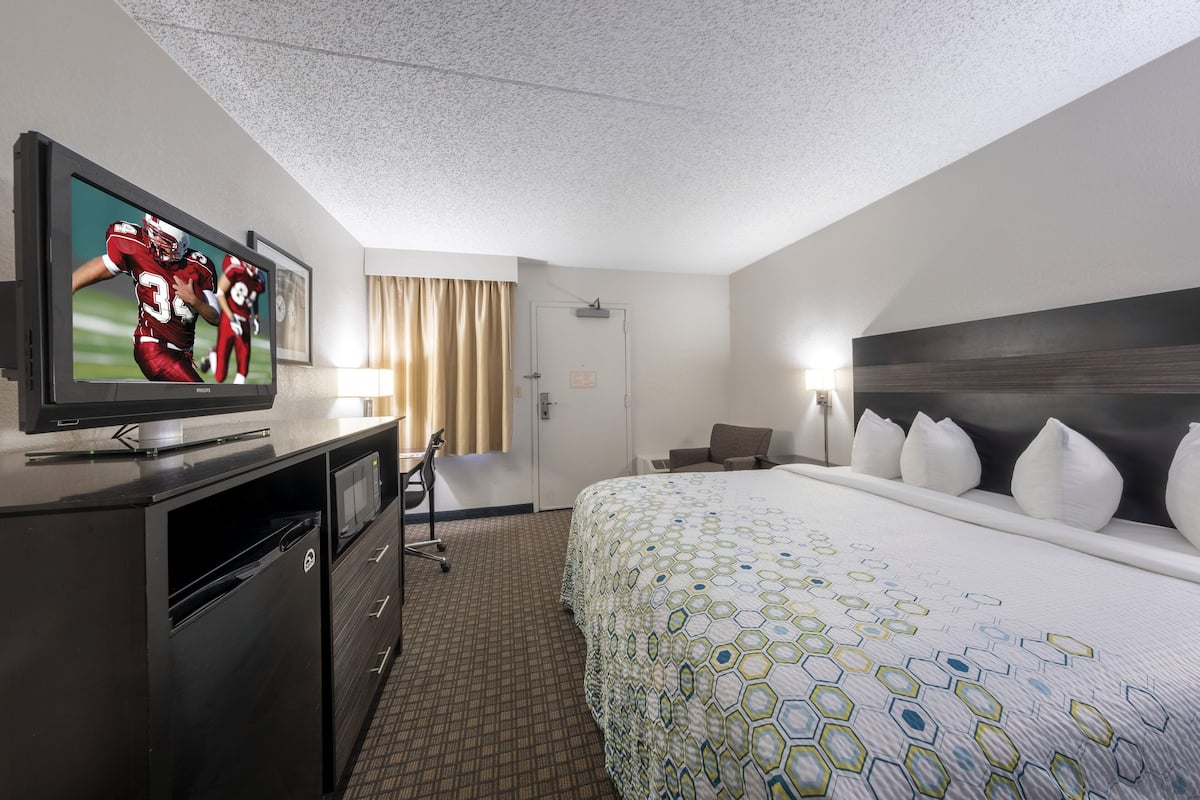 desk, laptop workspace, blackout curtains, iron/ironing board