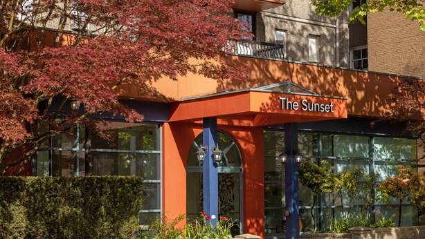 A building with a sign reading "The Sunset."