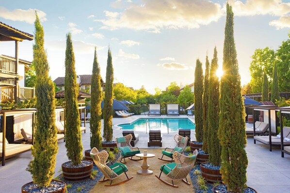 Outdoor pool, open 8 AM to 10 PM, cabanas (surcharge), pool umbrellas