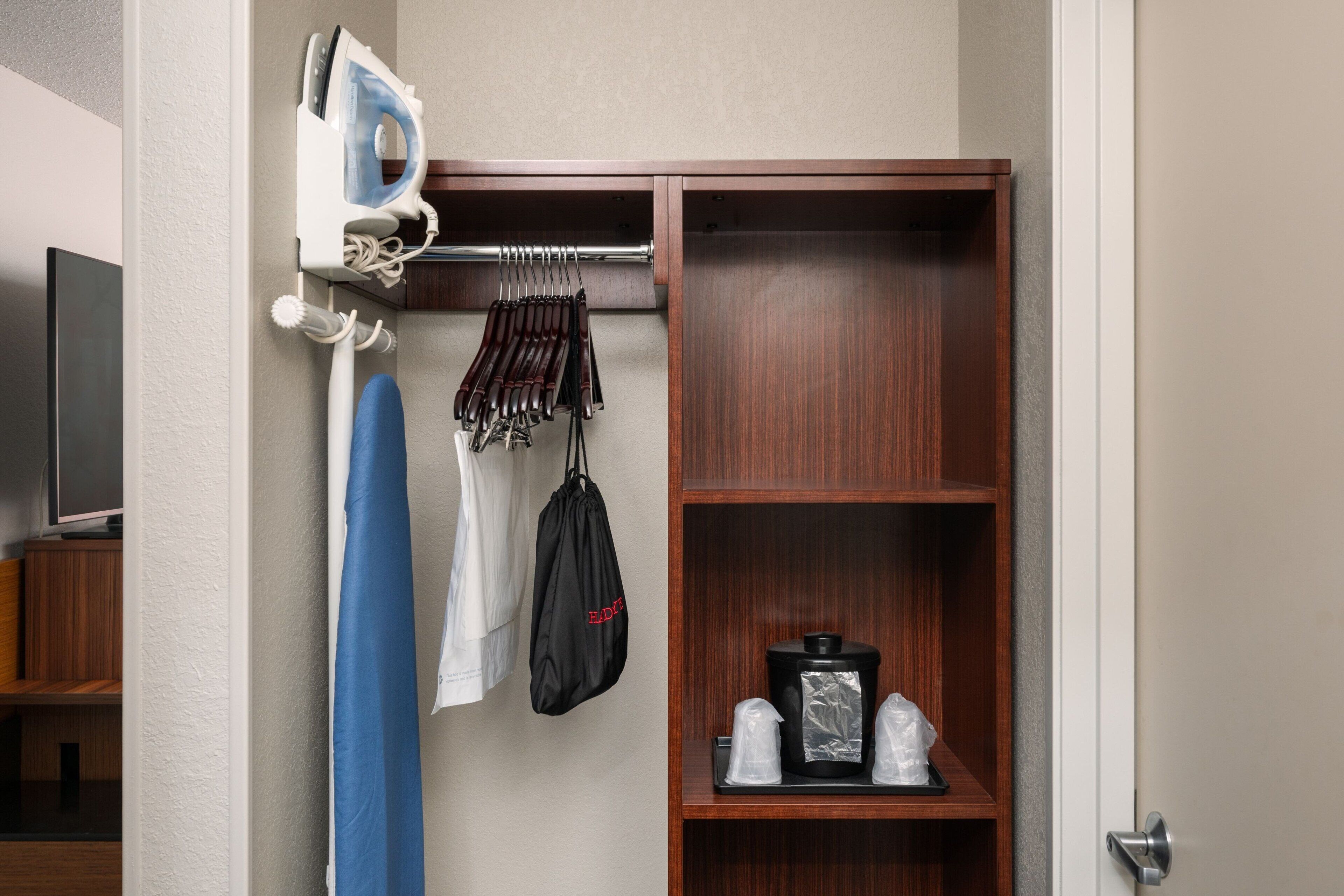 desk, laptop workspace, blackout curtains, iron/ironing board