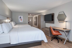 A hotel room with a large bed, a desk, a chair, a TV, and a wardrobe. - Holiday Inn Express & Suites Columbia-I-20 @ Clemson Rd by IHG (Columbia)