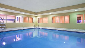 A large indoor swimming pool with clear blue water, surrounded by walls with windows. - Hampton Inn Dry Ridge (Dry Ridge)