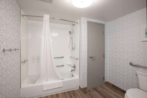 A modern bathroom with a glass-enclosed shower, a bathtub, and a toilet. - Hampton Inn Dry Ridge (Dry Ridge)