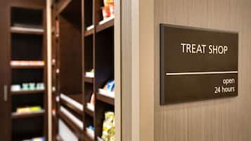 A sign indicating a treat shop open 24 hours.