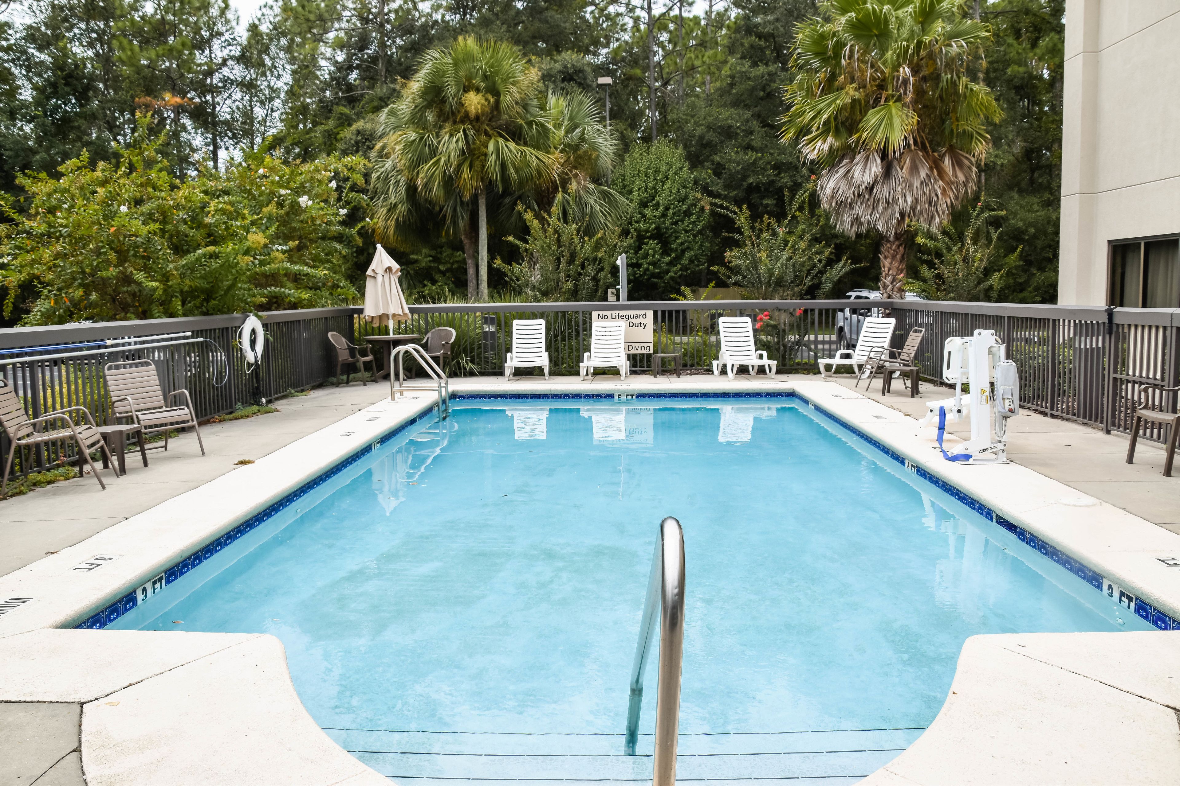 outdoor pool, open 9 am to 10 pm, pool umbrellas, pool loungers