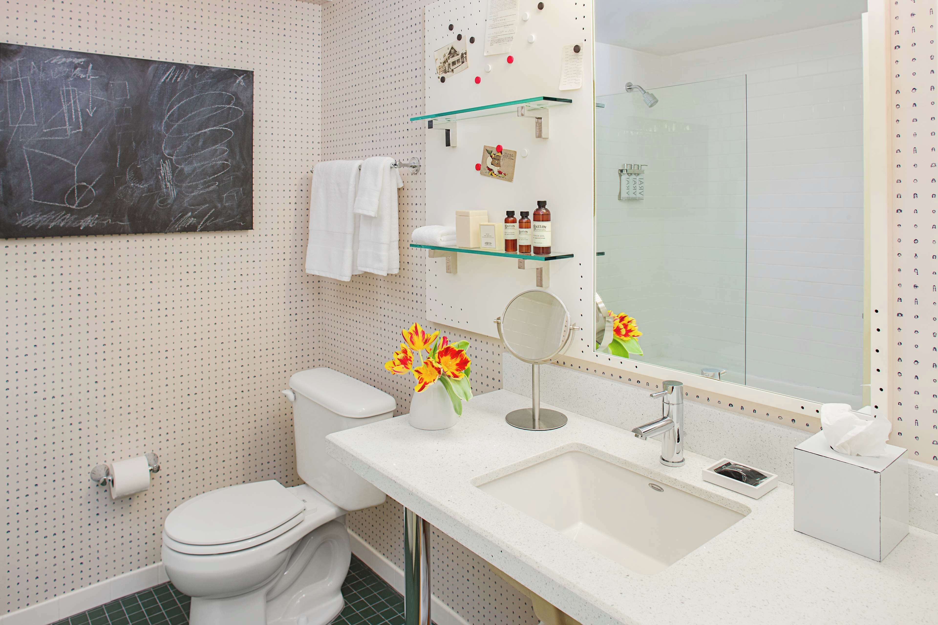 designer toiletries, hair dryer, towels, soap