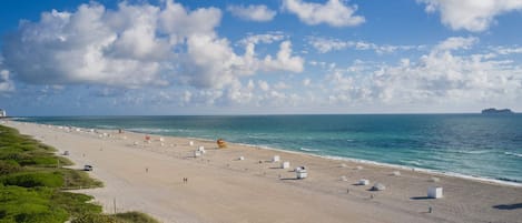 Beach nearby, white sand, beach towels