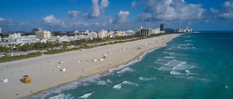 Beach nearby, white sand, beach towels