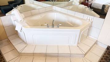 Suite, 1 King Bed, Non Smoking, Jetted Tub | Premium bedding, desk, blackout drapes, iron/ironing board