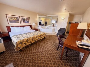 Suite, 1 King Bed, Non Smoking, Jetted Tub | Premium bedding, desk, blackout drapes, iron/ironing board - Travelodge by Wyndham Drumheller (Drumheller)