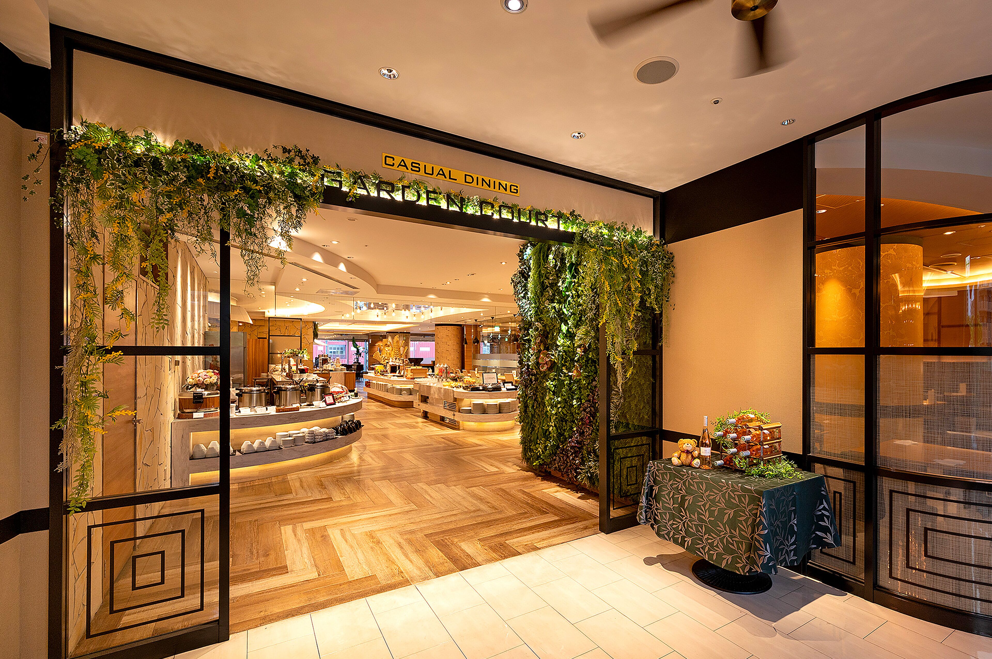 A restaurant with a wooden floor and a sign that reads 'CASUAL DINING.'