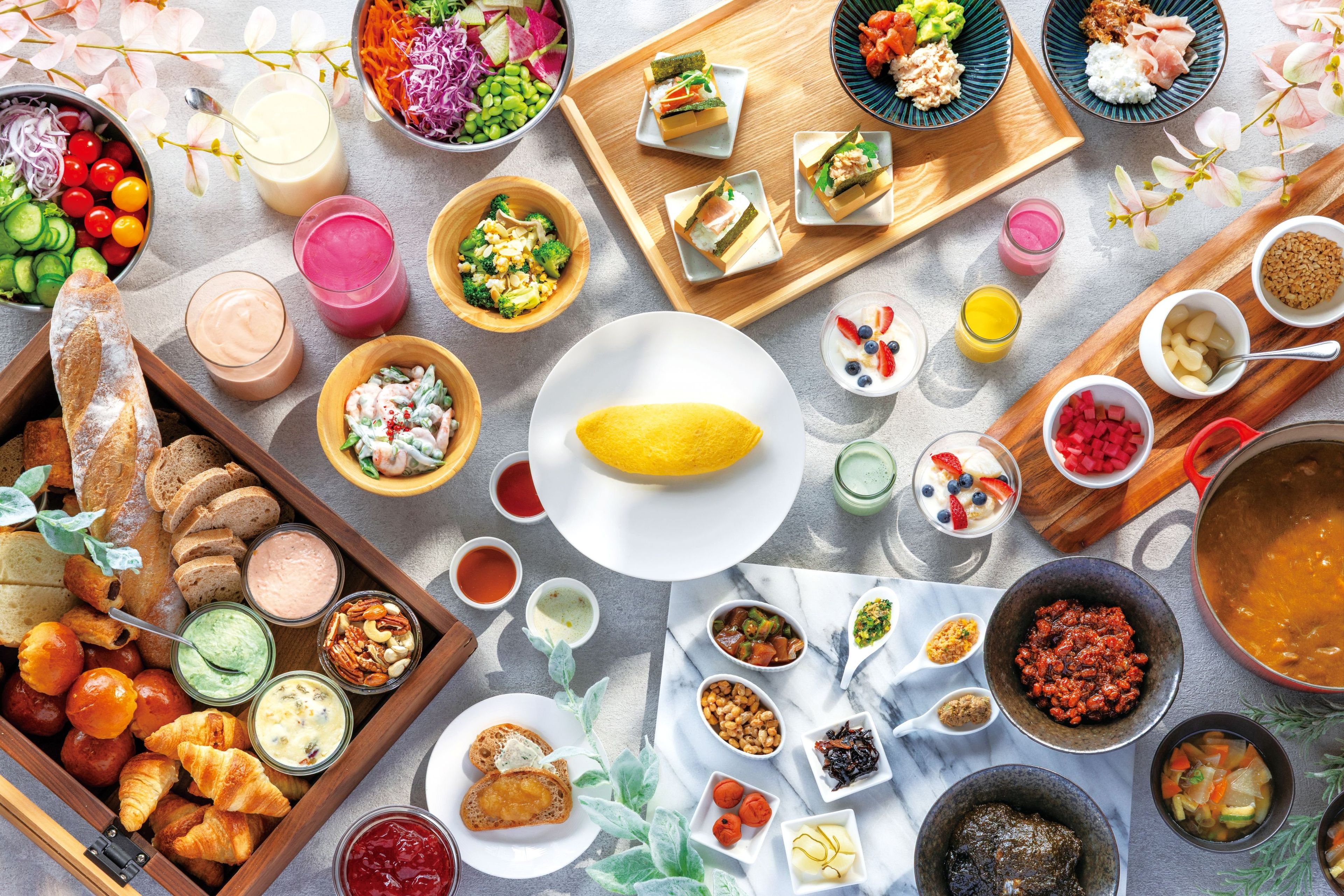 A variety of food items and beverages arranged on a table.