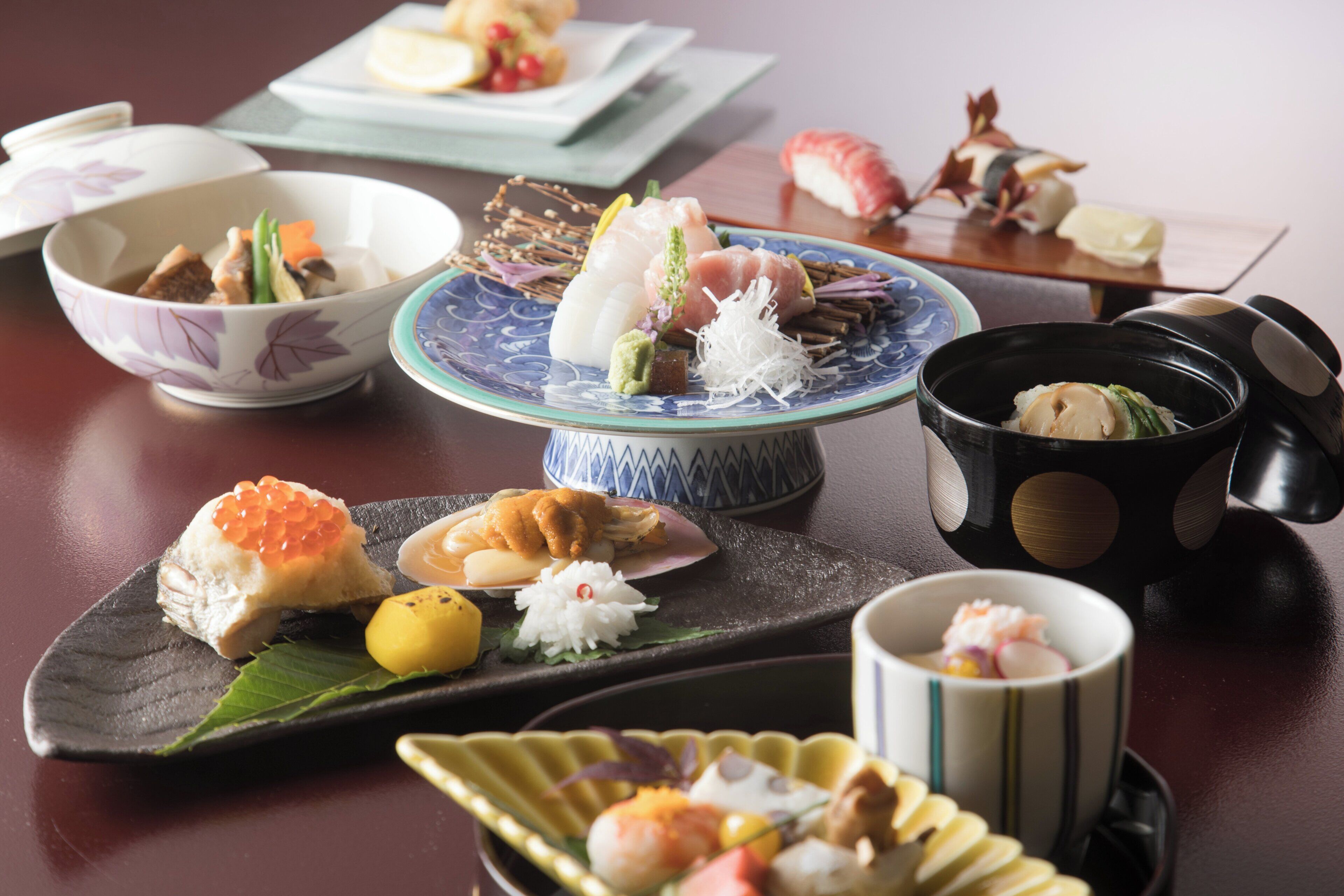 A variety of Japanese dishes arranged on a table.