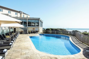 Seasonal outdoor pool, pool umbrellas
