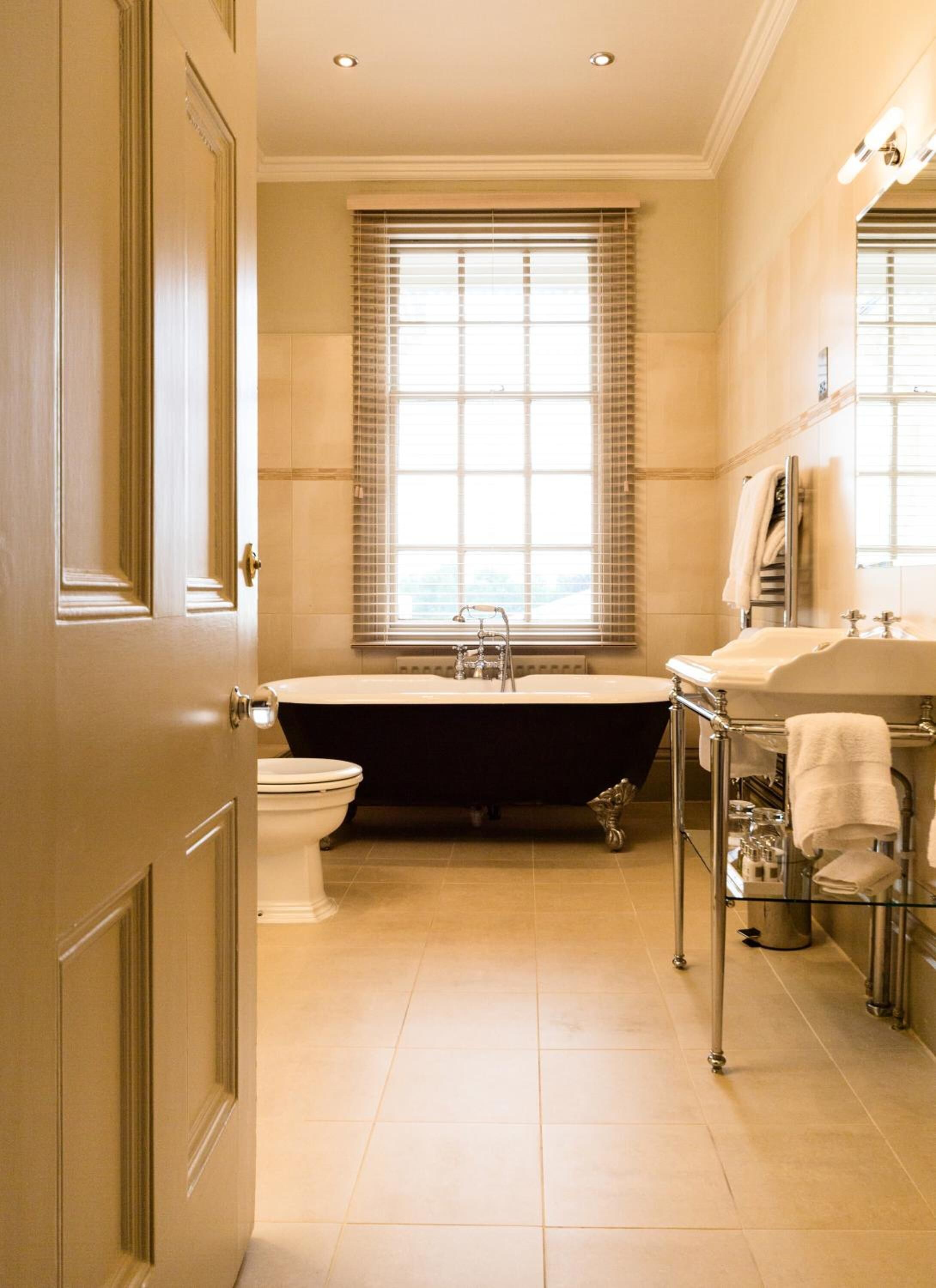 designer toiletries, hair dryer, bathrobes, slippers