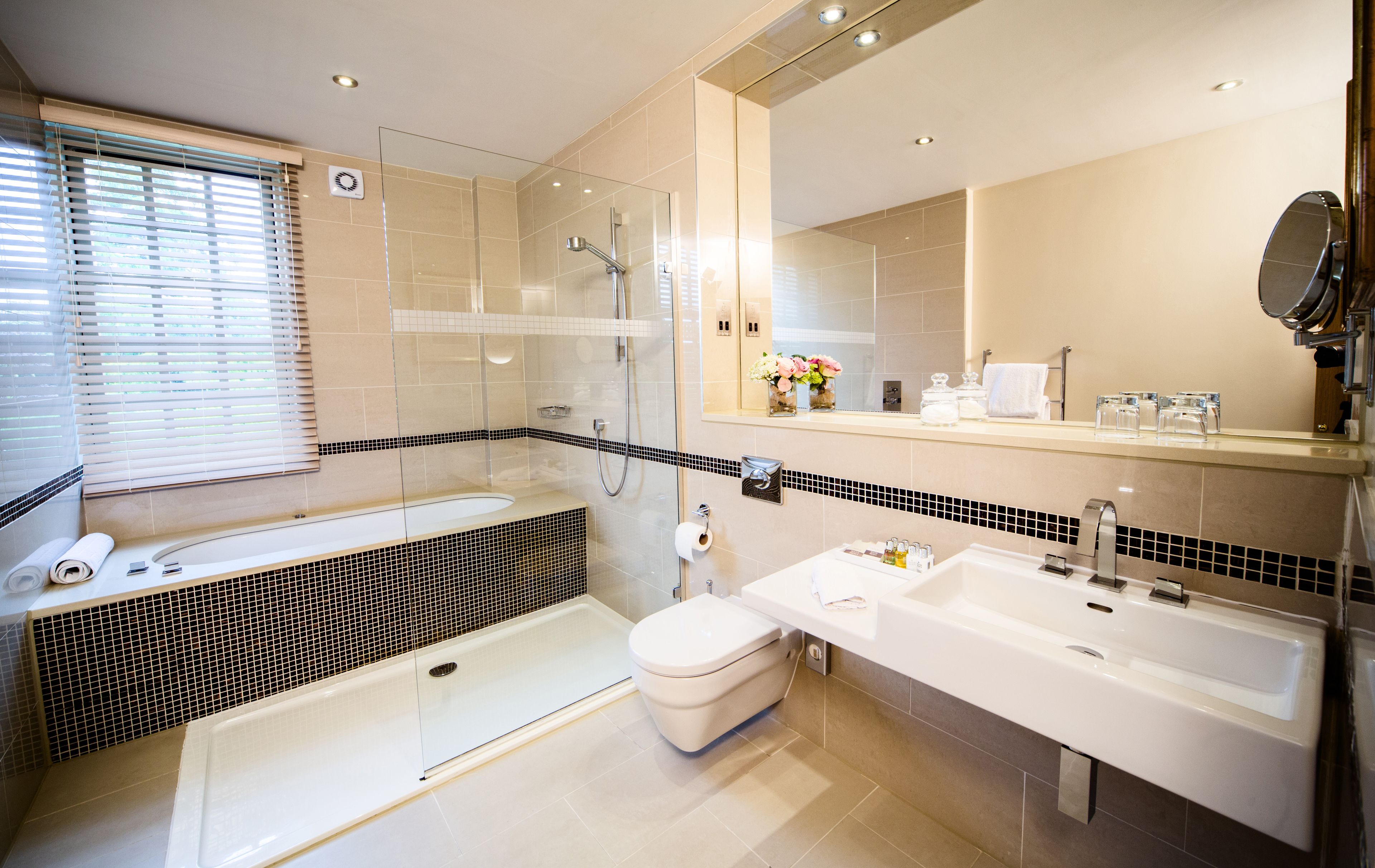 designer toiletries, hair dryer, bathrobes, slippers