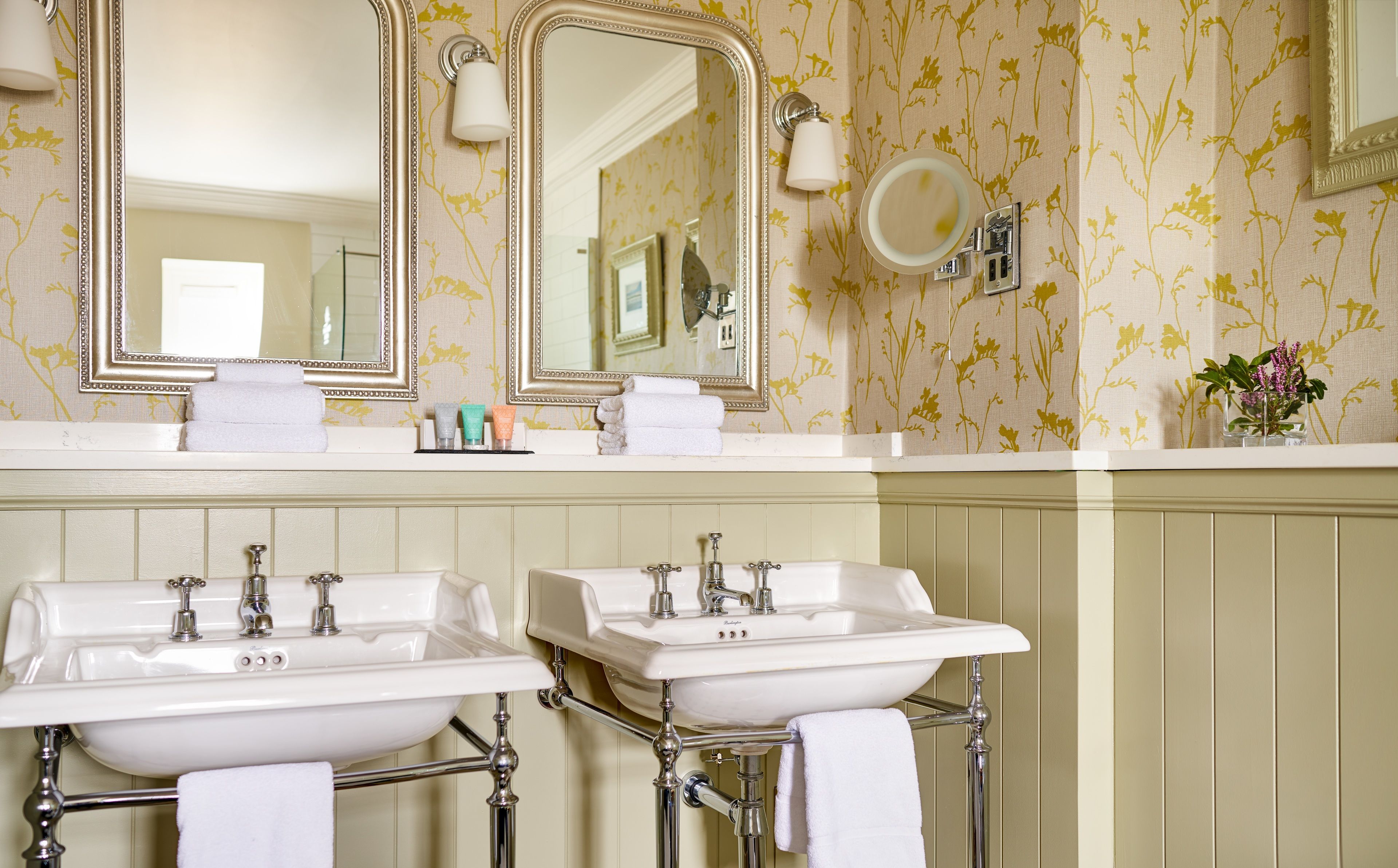 combined shower/bathtub, designer toiletries, hair dryer, bathrobes