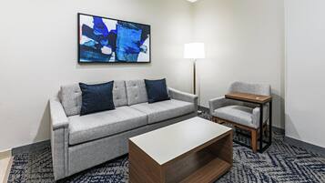 Hypo-allergenic bedding, desk, laptop workspace, blackout curtains