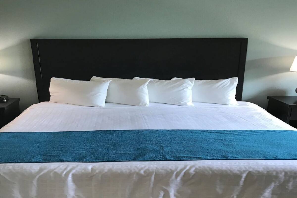 Premium bedding, pillow-top beds, blackout curtains, iron/ironing board