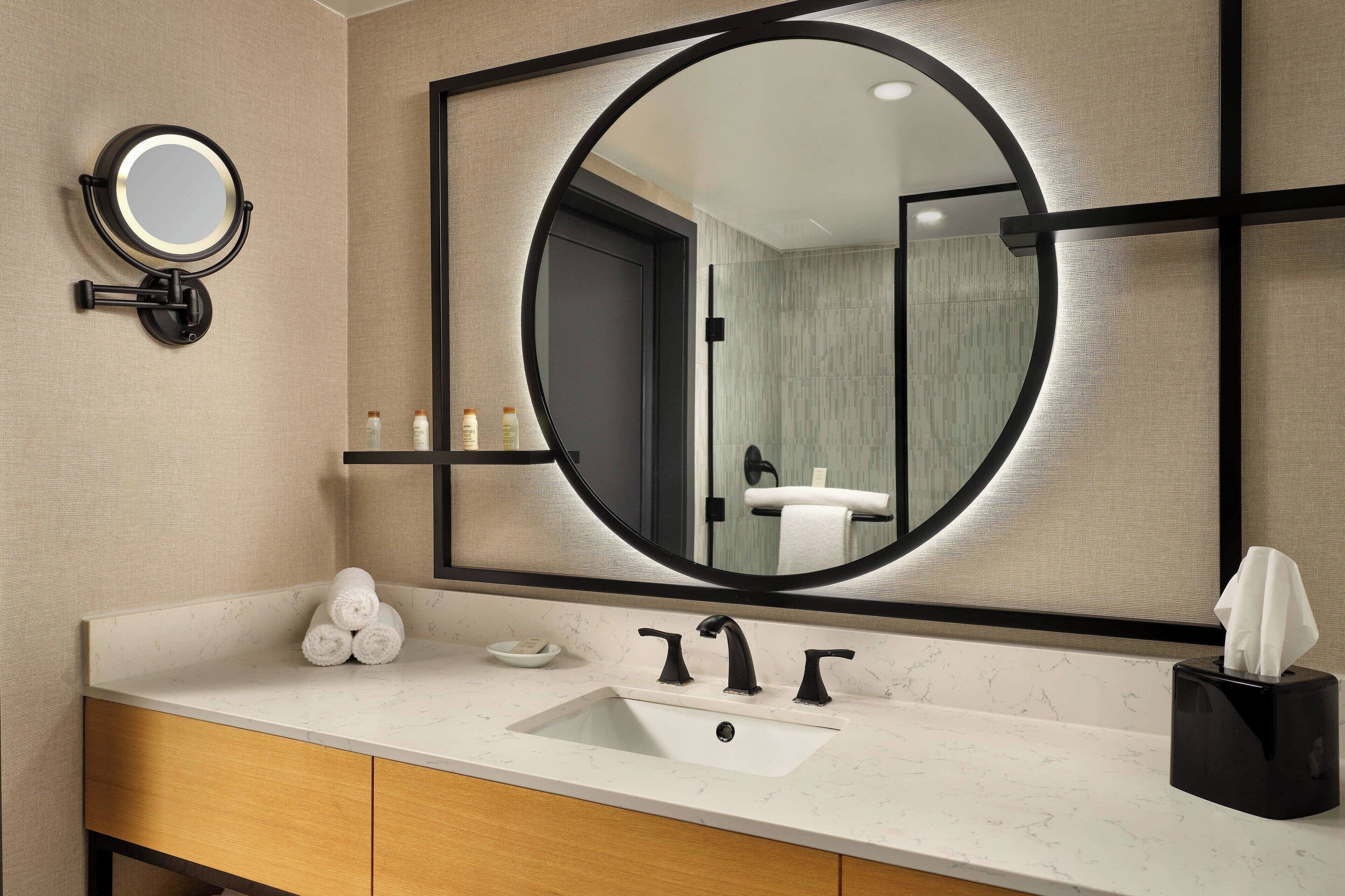 designer toiletries, hair dryer, towels, soap