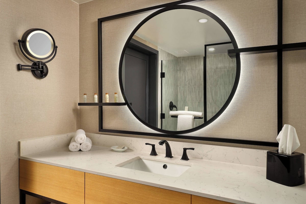 designer toiletries, hair dryer, towels, soap