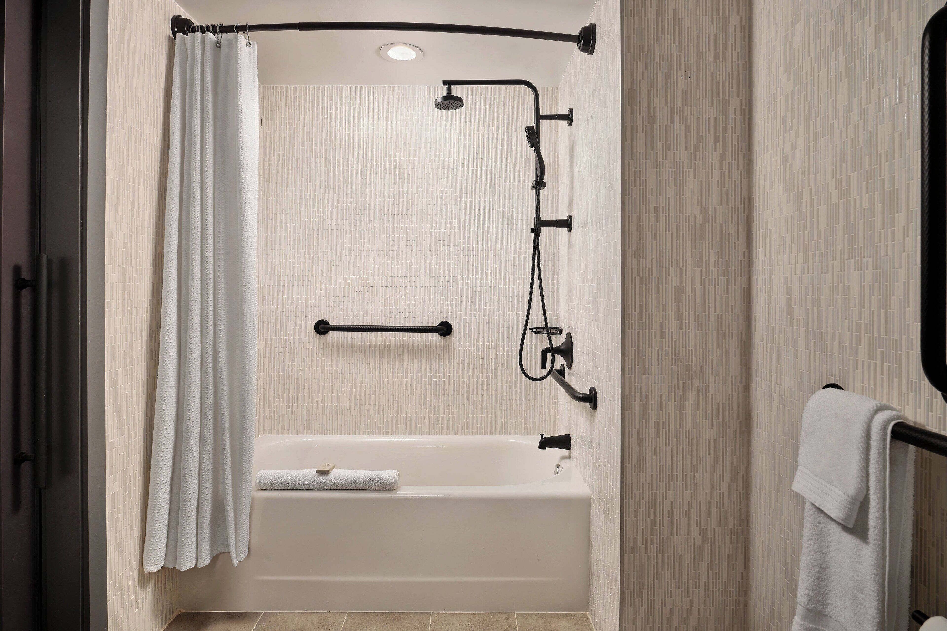 designer toiletries, hair dryer, towels, soap