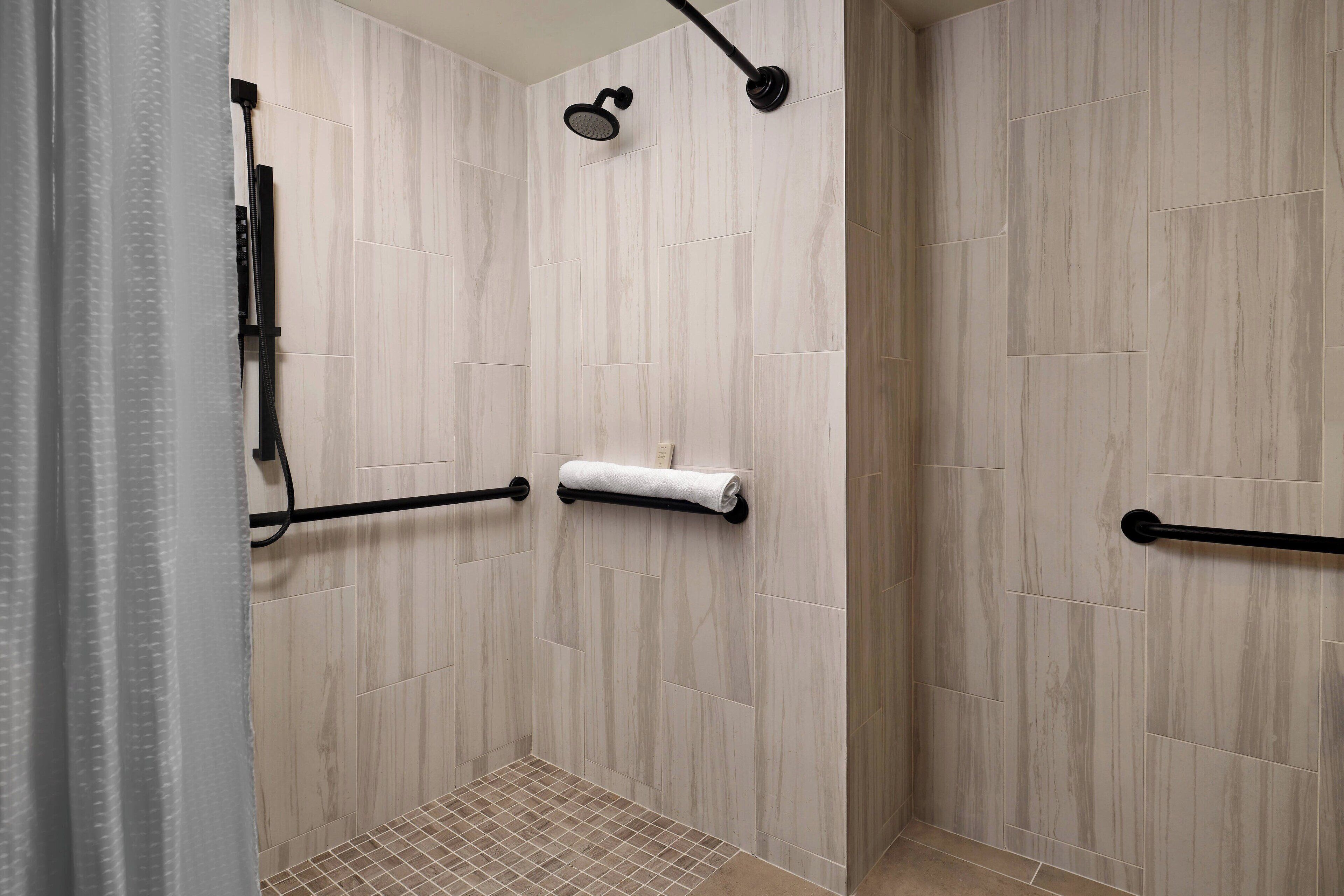 designer toiletries, hair dryer, towels, soap