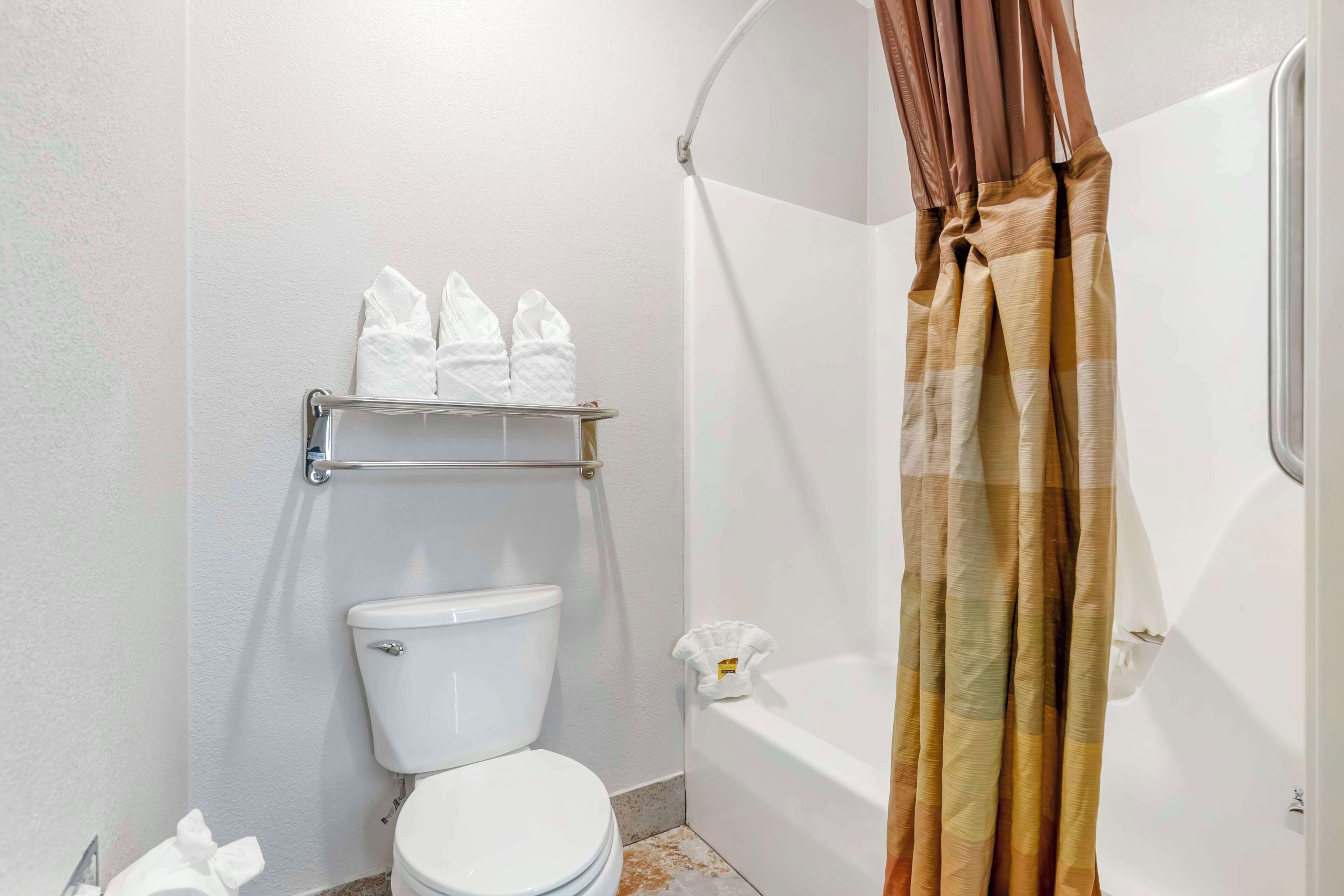 suite, 2 queen beds, non smoking, refrigerator & microwave | bathroom | combined shower/bathtub, hair dryer, towels