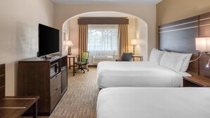 A hotel room with two beds, a desk with a chair, a television, and a window with curtains. - Best Western Champions Forest Inn and Suites (Houston)