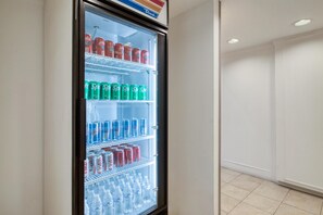A vending machine with various beverages including sodas and water. - Best Western Champions Forest Inn and Suites (Houston)