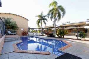 Outdoor pool, pool umbrellas, sun loungers