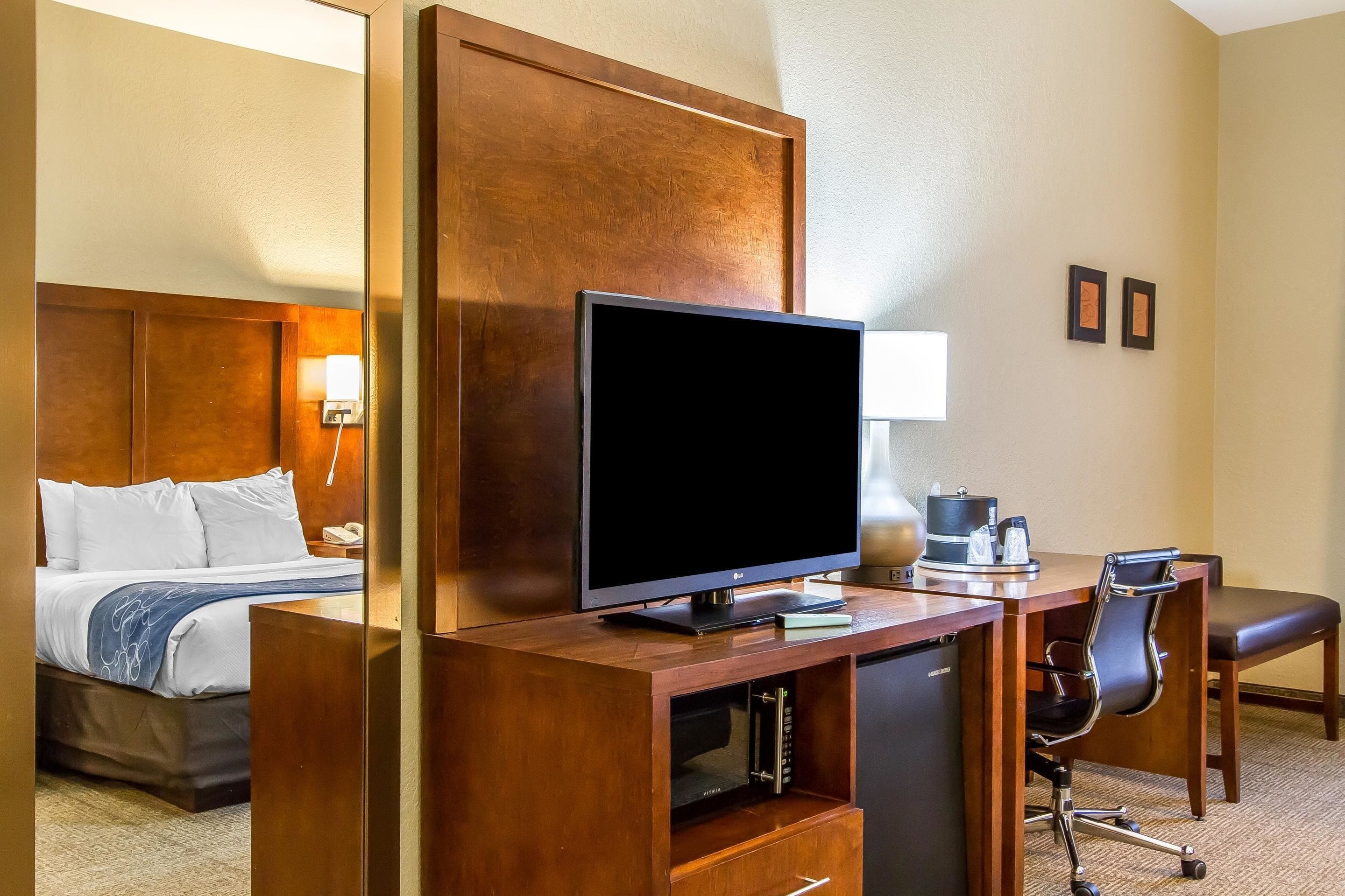 pillow-top beds, desk, laptop workspace, blackout curtains