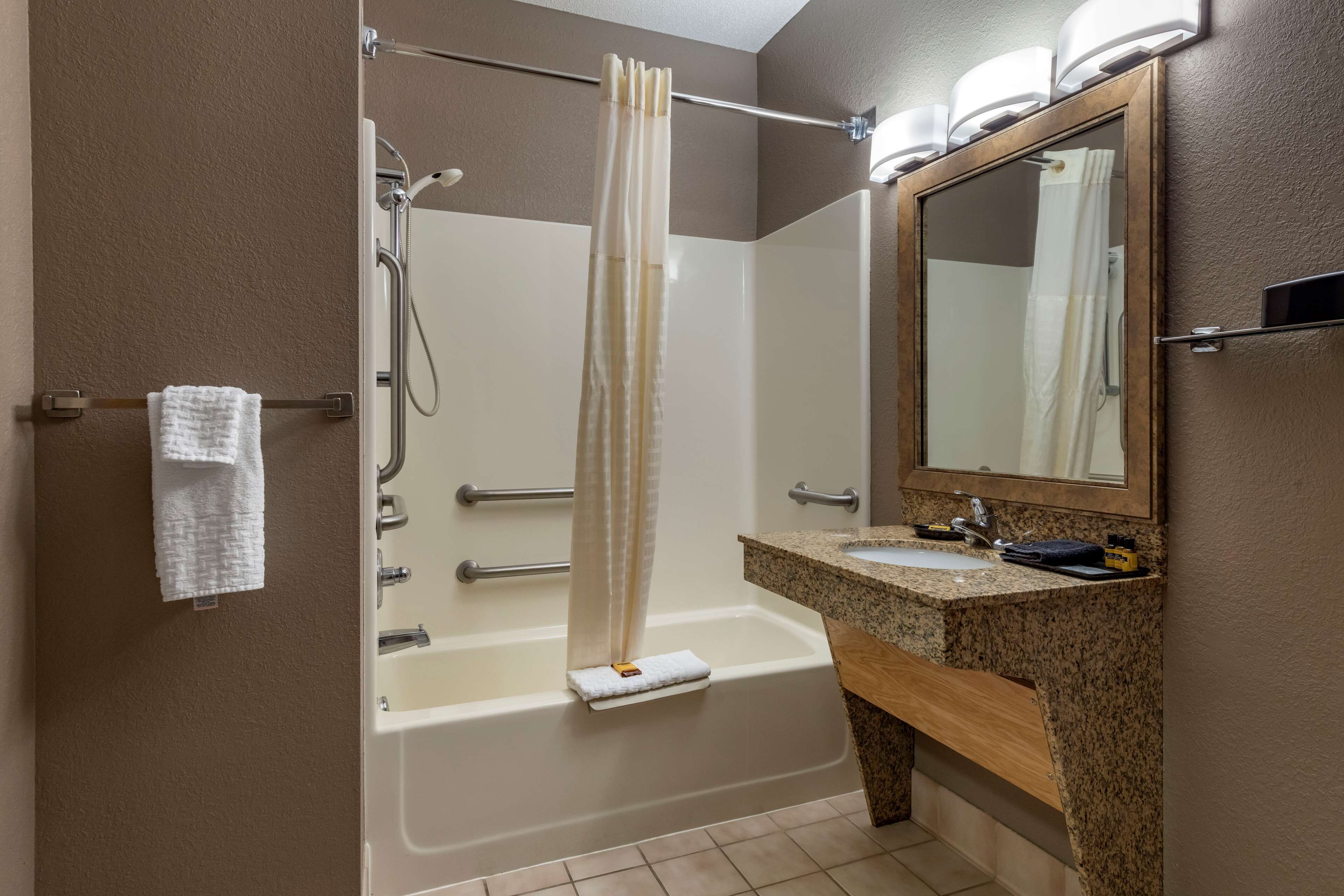 suite, 1 queen bed, accessible, refrigerator & microwave (with sofabed) | bathroom | combined shower/bathtub, free toiletries, hair dryer, towels