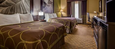 A hotel room with two beds, a desk, a chair, a dresser, and a large window with curtains.