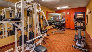 Stay fit and active with our well-equipped gym featuring a cable machine, bench press, and leg press.