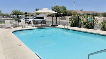 Outdoor pool, open 6:00 AM to 10:00 PM, pool loungers