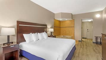 Deluxe Suite, 1 King Bed, Non Smoking | Premium bedding, down comforters, pillowtop beds, individually decorated
